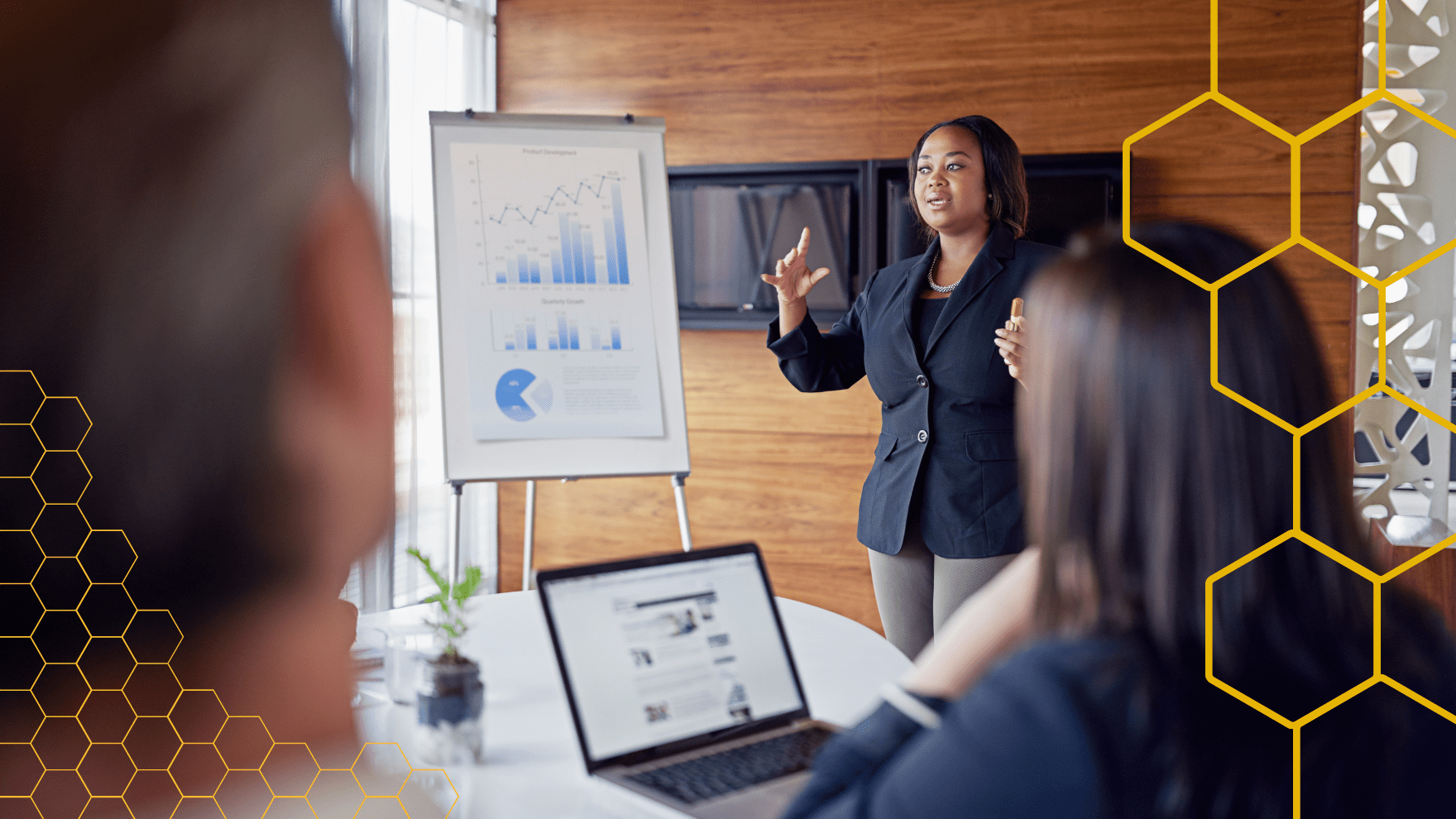 Woman standing at a presentation of Sage X3 explaining how it benefits businesses